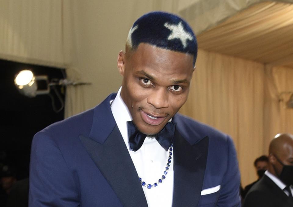 Russell Westbrook bends his head to show the white stars dyed into his hair at the 2021 Met Gala.