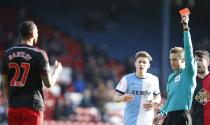 Swansea City's Kyle Bartley (L) is shown a red card by referee Craig Pawson during their FA Cup fourth round soccer match against Blackburn Rovers' at Ewood Park in Blackburn, northern England January 24, 2015. REUTERS/Andrew Yates (BRITAIN - Tags: SPORT SOCCER)