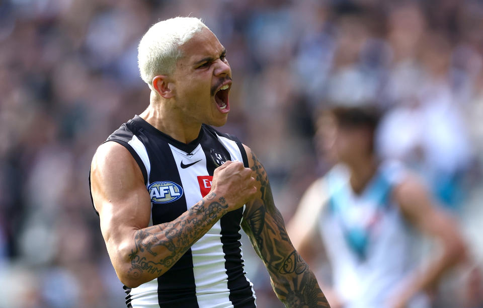 MELBOURNE, AUSTRALIA - APRIL 20: Bobby Hill of the Magpies celebrates kicking a goal  during the round six AFL match between Collingwood Magpies and Port Adelaide Power at Melbourne Cricket Ground, on April 20, 2024, in Melbourne, Australia. (Photo by Quinn Rooney/Getty Images)