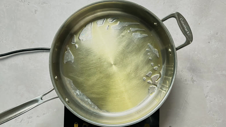 heating oil in skillet