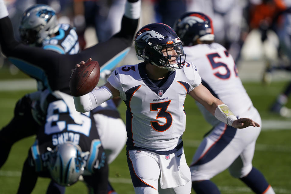 Denver Broncos quarterback Drew Lock passes against the Carolina Panthers during the first half of an NFL football game Sunday, Dec. 13, 2020, in Charlotte, N.C. (AP Photo/Brian Blanco)