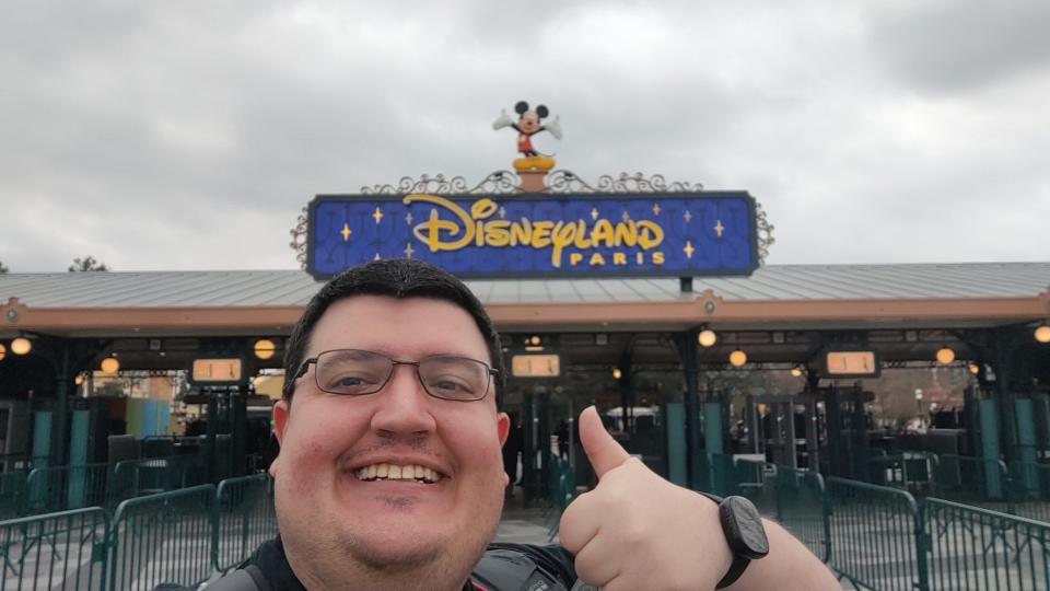 Nathan Firesheets snaps a selfie in front of Disneyland in Paris at the start of his epic, 12-day quest.