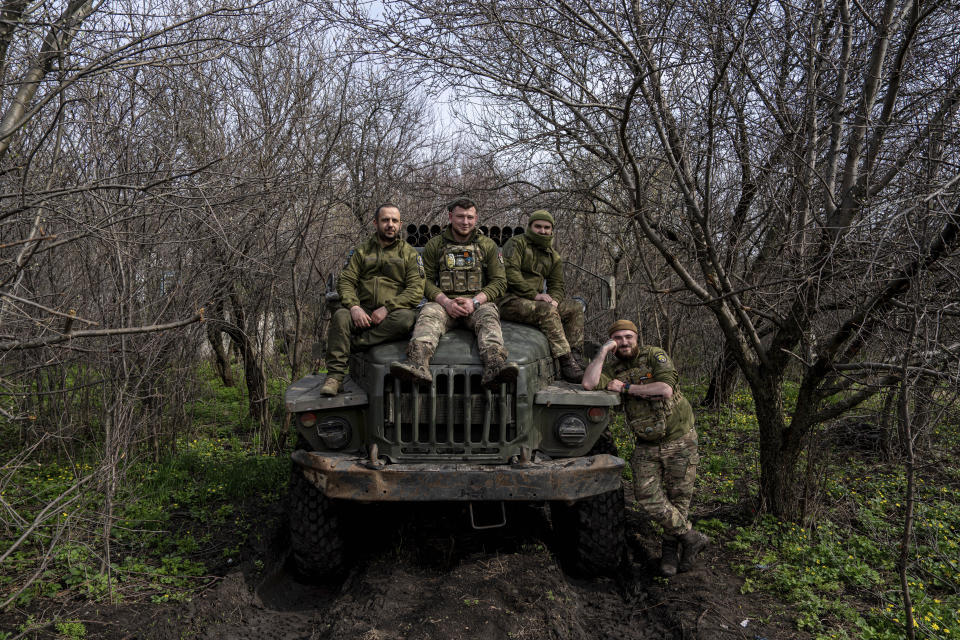 Ukrainian servicemen sit on their vehicle, on the frontline in Donetsk region, Ukraine, on Saturday, April 8, 2023. (AP Photo/Evgeniy Maloletka)