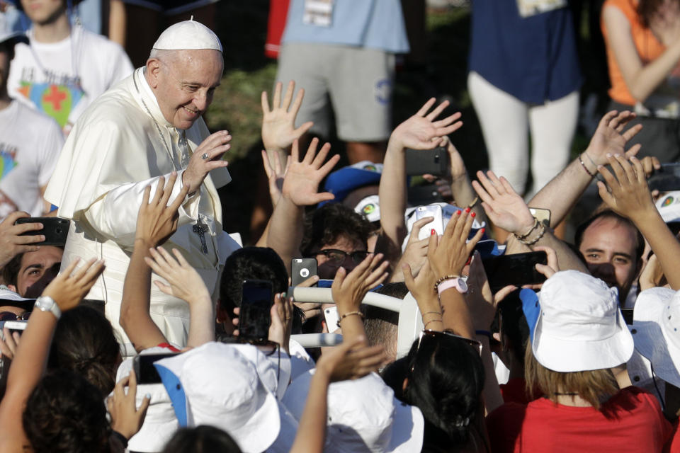 Pope Francis arrives at Rome's Circus Maximus to lead an evening prayer vigil with youths, Saturday, Aug. 11, 2018. Thousand of youths gathered for the meeting with the pontiff in preparation for the next World Youth Day that will be held in Panama next year. (AP Photo/Andrew Medichini)