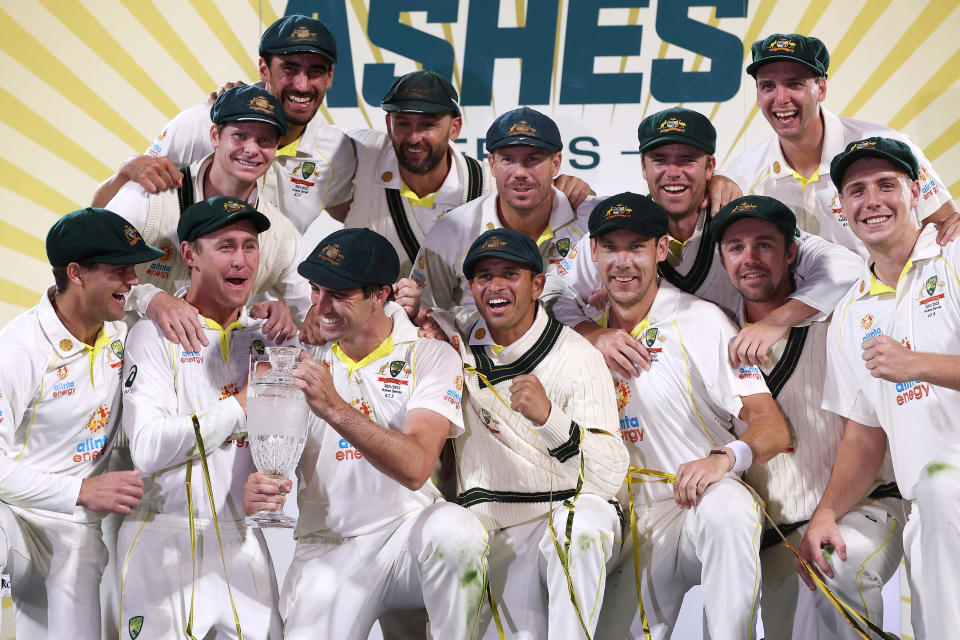 The Australian team celebrate victory during the presentation ceremony after day three of the Fifth Test in the Ashes series between Australia and England at Blundstone Arena.