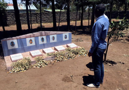 Quindos Karanja, who lost his family members in the Ethiopian Airlines ET 302 plane crash stands near their family grave site after a Reuters interview at their home in Nakuru County, Kenya April 5, 2019. REUTERS/George Nganga