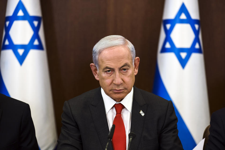 Israeli Prime Minister Benjamin Netanyahu convenes a weekly cabinet meeting at the Prime Minister's office in Jerusalem, Sunday, Jan. 8, 2023. (Ronen Zvulun/Pool Photo via AP)