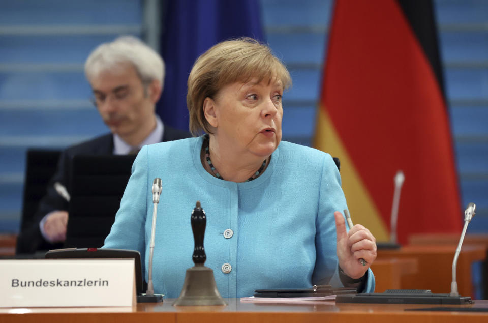 German Chancellor Angela Merkel speaks prior to the start of the weekly cabinet meeting at the Chancellery in Berlin, Germany, Wednesday, June 10, 2020. (Fabrizio Bensch/Pool Photo via AP)