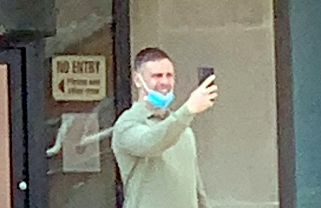 Nathan Buckley on his phone outside court after being found guilty of punching a pregnant woman. (SWNS)