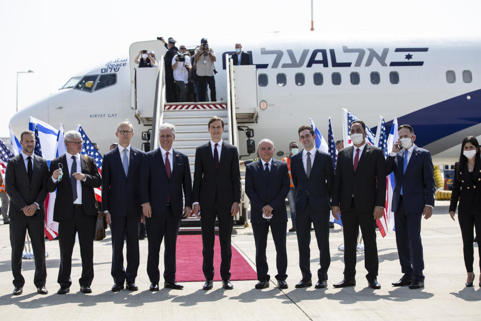 U.S. President Donald Trump’s senior adviser and son-in-law Jared Kushner, center, national security adviser Robert O’Brien, fourth left, and Israeli and American delegations pose for a photo before their departure to Abu Dhabi, at Ben-Gurion Airport, in Lod, near Tel Aviv, Israel, Monday, Aug. 31, 2020. (Heidi Levine/Pool via AP).