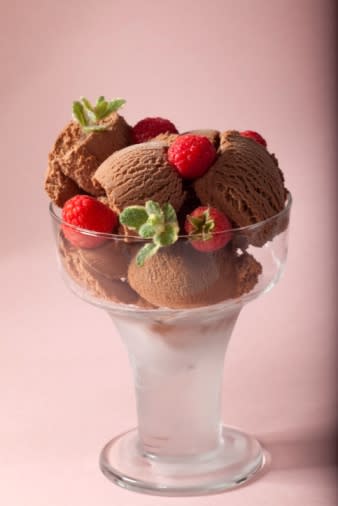 Chocolate ice cream topped with raspberries