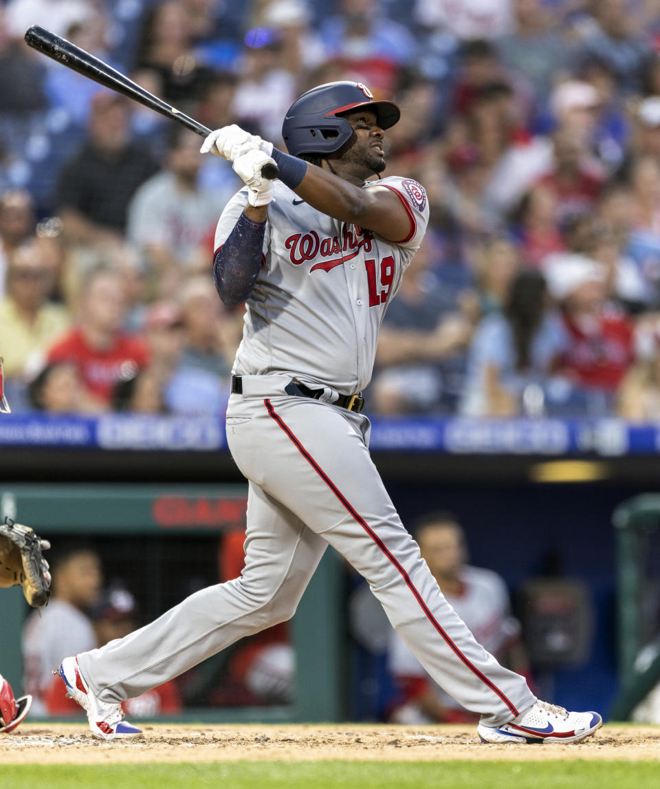 Washington Nationals' Josh Bell watches his RBI-triple during the fourth inning of a baseball game against the Philadelphia Phillies, Monday, July 26, 2021, in Philadelphia. (AP Photo/Laurence Kesterson)