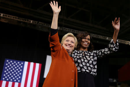 U.S. Democratic presidential candidate Hillary Clinton arrives to a campaign rally accompanied by U.S. first lady Michelle Obama in Winston-Salem, North Carolina, U.S. on October 27, 2016. REUTERS/Carlos Barria/File Photo