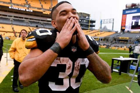 Pittsburgh Steelers running back James Conner (30) acknowledges fans as he leaves the field after an NFL football game against the Cleveland Browns - Credit: AP Photo/Don Wright