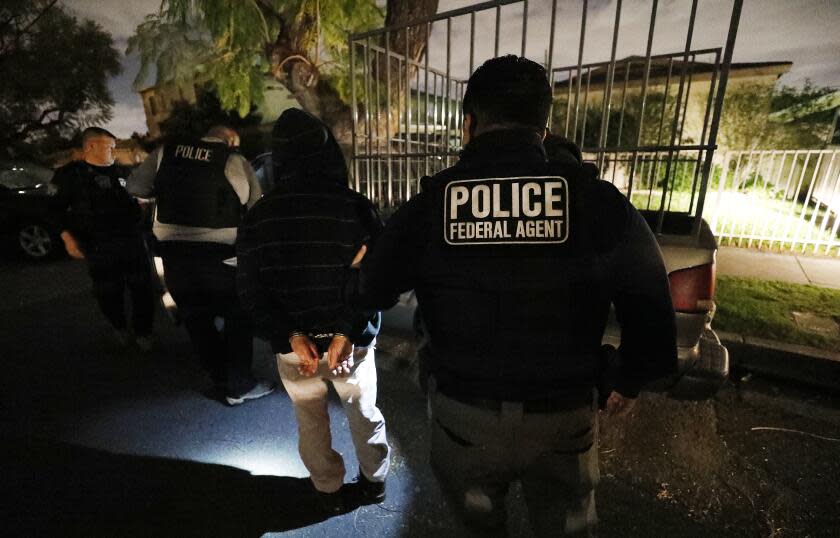 David A. Marin, far left, Field Office Director Enforcement and Removal Operations Los Angeles Field Office of U.S. Immigration and Customs Enforcement (ICE) during a pre-dawn apprehension of Pedro Castillo Bravo as ICE officers are joined by (CBP) U.S. Customs & Border Protection agents in the last few weeks, as more resources are deployed in sanctuary cities.