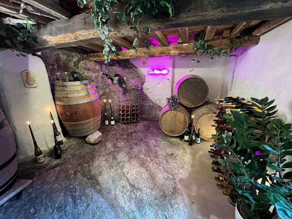 cellar with stone floor and barrels of wine