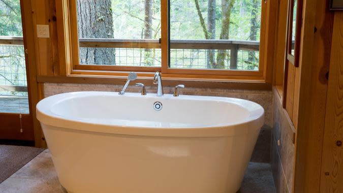 freestanding soaking tub in master bathroom-shutterstock_1082168360