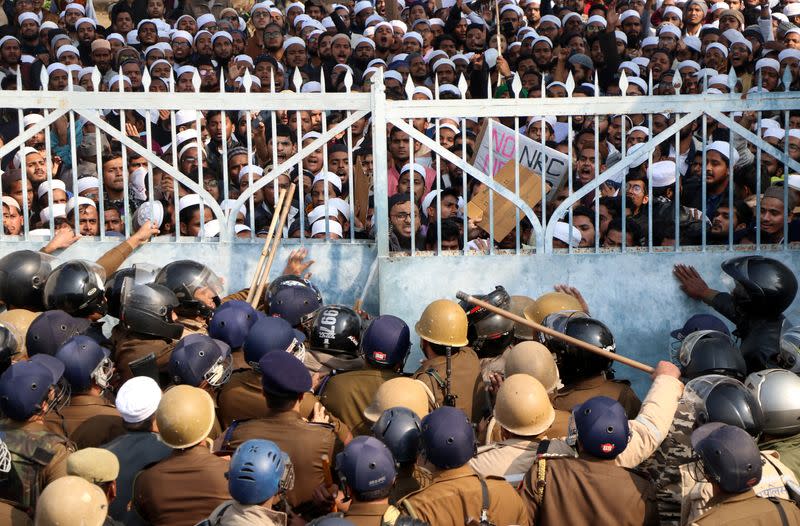 Students of Darul Uloom Nadwatul Ulama are stopped by police during a protest against a new citizenship law, in Lucknow