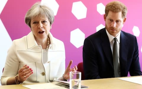 Theresa May and Prince Harry - Credit: SIMON DAWSON /Reuters