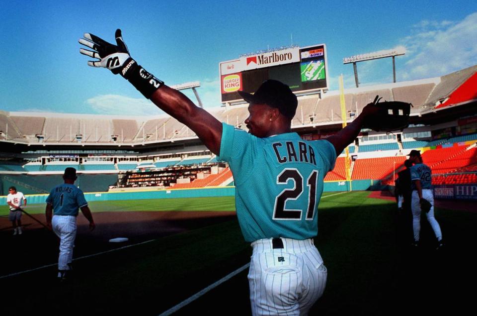 Then-Florida Marlins outfielder Chuck Carr enters Joe Robbie Stadium with his arms up saying “MY HOME,” before a light workout in this file photo from April 24, 1995. The Miami Marlins have had its own stadium since 2012 but in the 1990s the baseball team, and rock groups like the Rolling Stones, used the Miami Gardens venue, now Hard Rock Stadium.