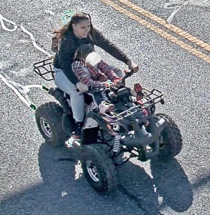 In this file photo, a woman captured on surveillance video carrying a small child rides an all-terrain vehicle illegally at the intersection of Burhans Boulevard and West Washington Street. Hagerstown Police sought the public's help to identify the woman.