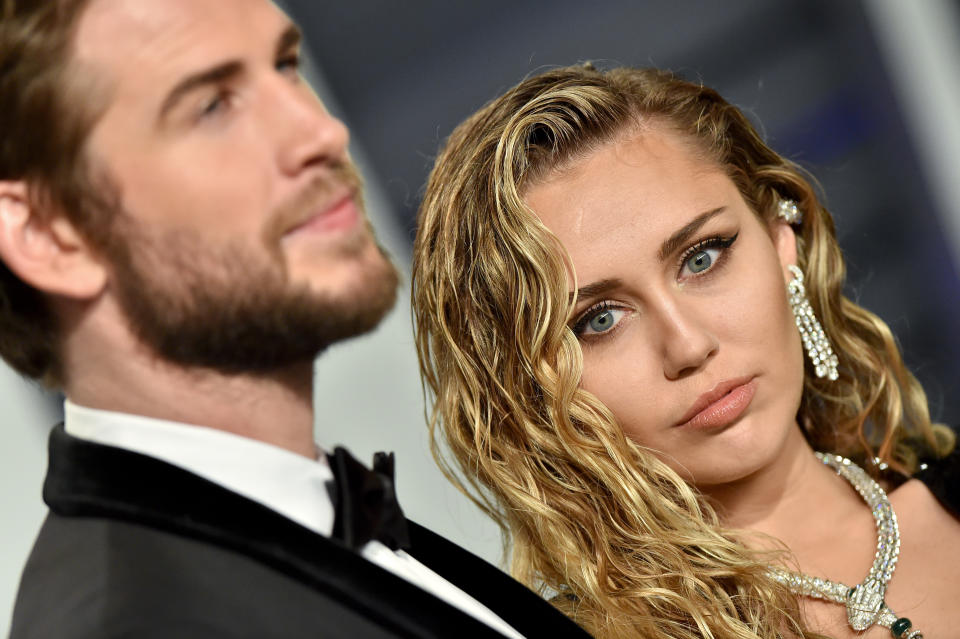 BEVERLY HILLS, CALIFORNIA - FEBRUARY 24: Miley Cyrus and Liam Hemsworth attend the 2019 Vanity Fair Oscar Party Hosted By Radhika Jones at Wallis Annenberg Center for the Performing Arts on February 24, 2019 in Beverly Hills, California. (Photo by Axelle/Bauer-Griffin/FilmMagic)