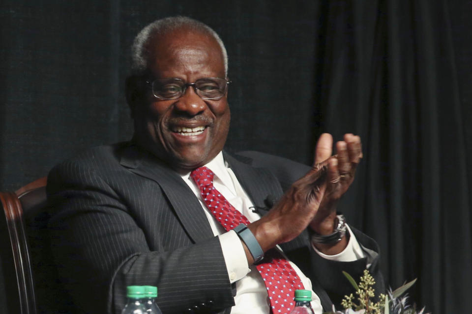 FILE - Supreme Court Justice Clarence Thomas laughs before speaking to an audience at McLennan Community College in Waco, Texas, on Sept. 7, 2017. Records obtained by The Associated Press show that Supreme Court justices have attended publicly funded events at colleges and universities that allowed the schools to put the justices in the room with influential donors, including some whose industries have had interests before the court. (Rod Aydelotte/Waco Tribune-Herald via AP, File)