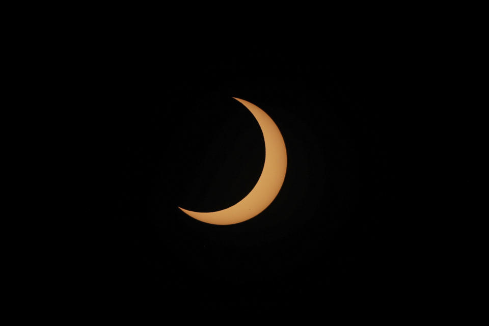 An annular solar eclipse seen from Tatacoa Desert, Colombia, Saturday, Oct. 14, 2023. The annular eclipse dimmed the skies over parts of the western U.S. and Central and South America. (AP Photo/Ivan Valencia)