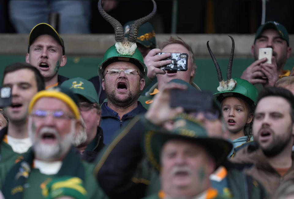 Supporters sing during the national anthems at the start of the Rugby Championship test between South Africa and Wales at at Free State Stadium in Bloemfontein, South Africa, Saturday, July 9, 2022. (AP Photo/Themba Hadebe)