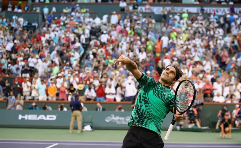 Roger Federer celebrates his straight sets win over Rafael Nadal in their fourth round match at Indian Wells