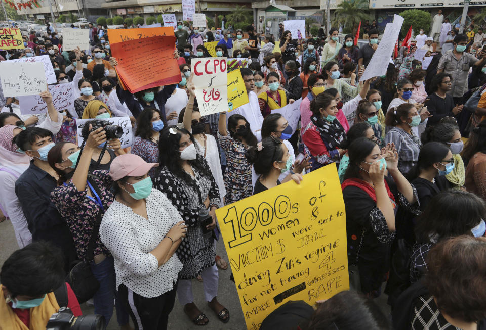 Members of civil society groups take part in a rally to condemn the incident of rape on a deserted highway, in Karachi, Pakistan, Saturday, Sept. 12, 2020. Pakistani police said they detained 15 people for questioning after two armed men allegedly gang raped a woman in front of her children after her car broke down on a deserted highway near the eastern city of Lahore. (AP Photo/Fareed Khan)