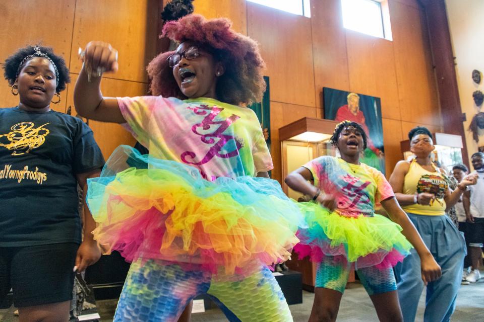 D'anglia McMillan, center, performs in a hip-hop performance with the Real Young Prodigys group inside the new Roots 101 Museum space on Juneteenth. June 19, 2021