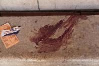 Bloodstains on a bench at the scene inside the St. Mark Cathedral in central Cairo, following a bombing, Sunday, Dec. 11, 2016. The blast at Egypt's main Coptic Christian cathedral killed dozens of people and wounded many others on Sunday, according to Egyptian state television, making it one of the deadliest attacks carried out against the religious minority in recent memory. (AP Photo/Nariman El-Mofty)