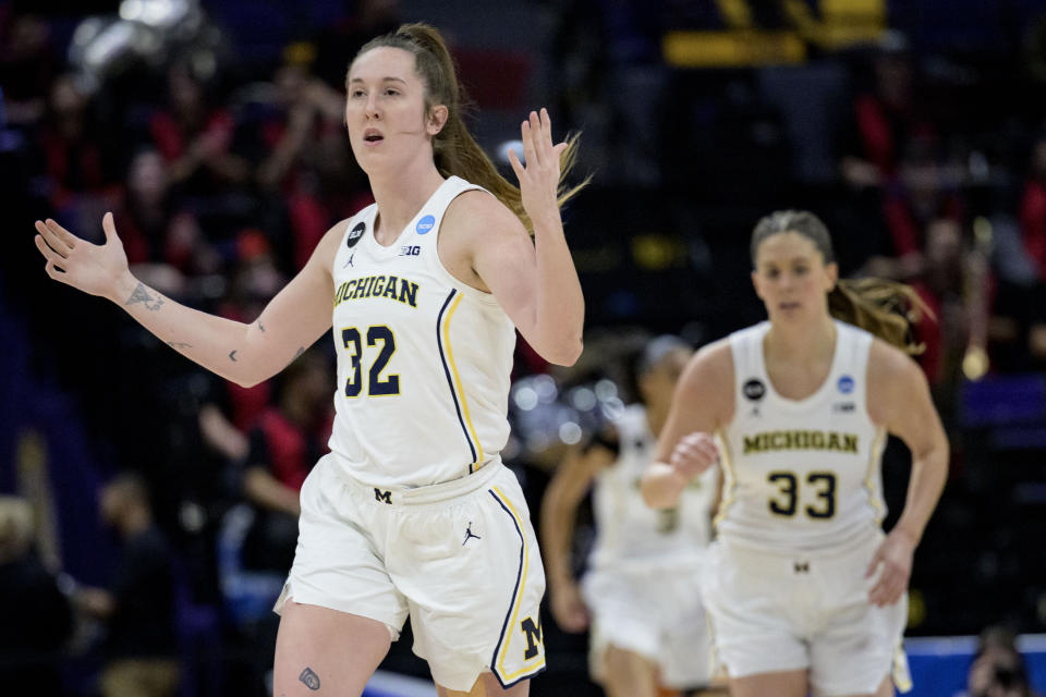 Michigan guard Leigha Brown (32) celebrates a 3-point basket by forward Emily Kiser (33) in the first half of a first-round college basketball game against UNLV in the women's NCAA Tournament in Baton Rouge, La., Friday, March 17, 2023, (AP Photo/Matthew Hinton)