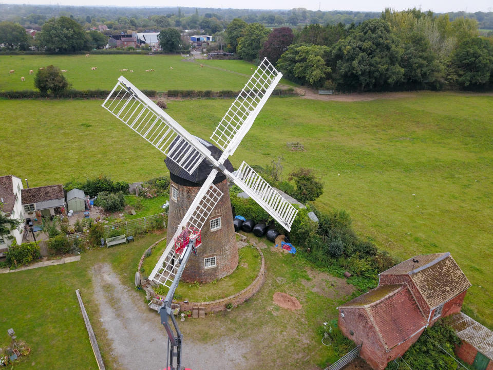 A homeowner has completed the ultimate lockdown DIY project at one of Britain's last fully-working windmills - after using a cherry picker to paint the sails by hand. Jeanette McGarry, 58, painstakingly spent three weeks touching up the paintwork on the gigantic five tonne sails as part of a refurbishment of historic Berkswell Windmill. The 70ft tall Grade II-listed building has been standing for nearly 200 years in the village of Balsall Common, West Mids., and was bought by Jeannette in 2005. She then spent £200,000 restoring the 19th century four-bladed tower mill to its former glory with the help of English Heritage after it fell into a state of disrepair.