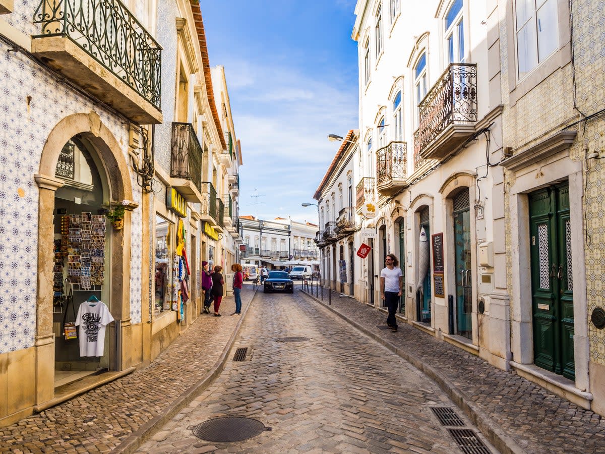 Street in the old town of Tavira in the Algarve region of Portugal  (Alamy Stock Photo)