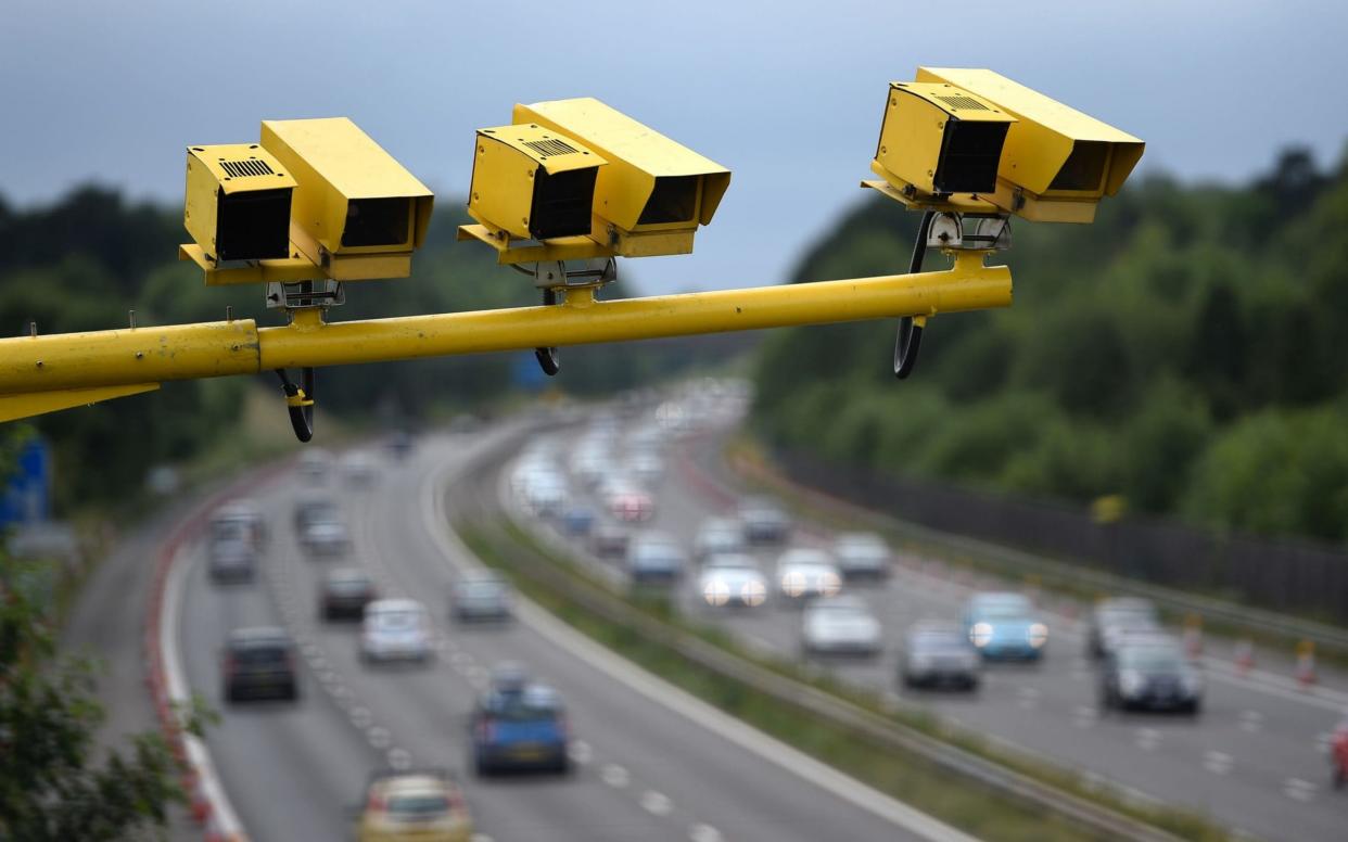 Speed cameras overlooking a motorway in Bedfordshire - PA