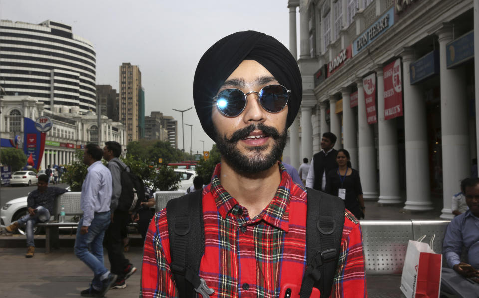 In this Tuesday, April 16, 2019, photo, Rajanvir Singh Luthra, 23, a You Tube vlogger, stands for a photograph in New Delhi, India. With nearly half the electorate under 35 and more than 15 million first time voters, India's young can swing the national vote in the world's largest democracy in any direction. “Whichever government comes to power, the first thing they should do is to look after the poor because the rate of poverty is very high in India. No doubt, we now have digital India, we have everything online, but do something for the poor people also,” Luthra told the Associated Press. (AP Photo/Manish Swarup)