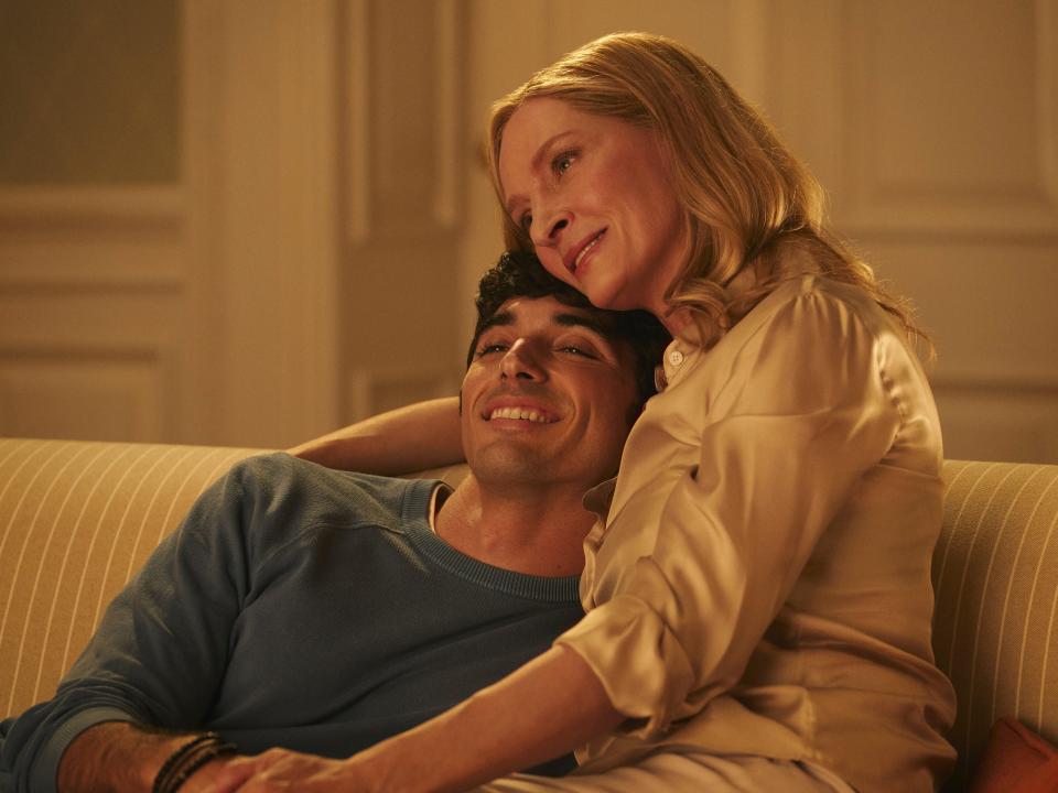 alex and ellen, his mom, cuddling together on a couch, smiling