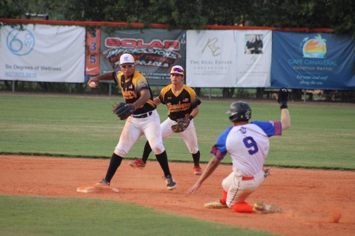 Leesburg Lightning shortstop Ramses Cordova makes a play a second play and tosses a relay to first while second baseman Gabriel Santiago backs up the play Saturday in the Lightning's 7-4 win against Winter Garden at West Orange High School in Winter Garden.