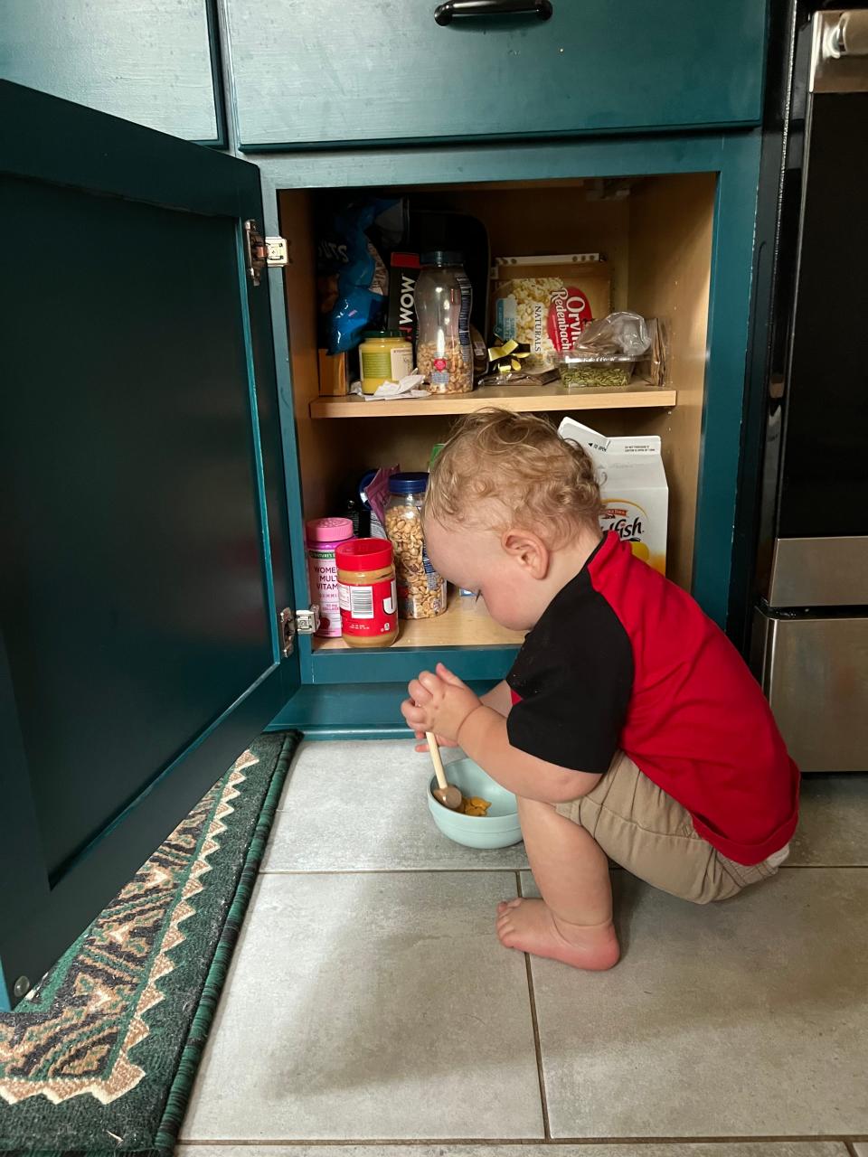 Instead of keeping the cabinets locked, we’ve made sure he can play in them safely.