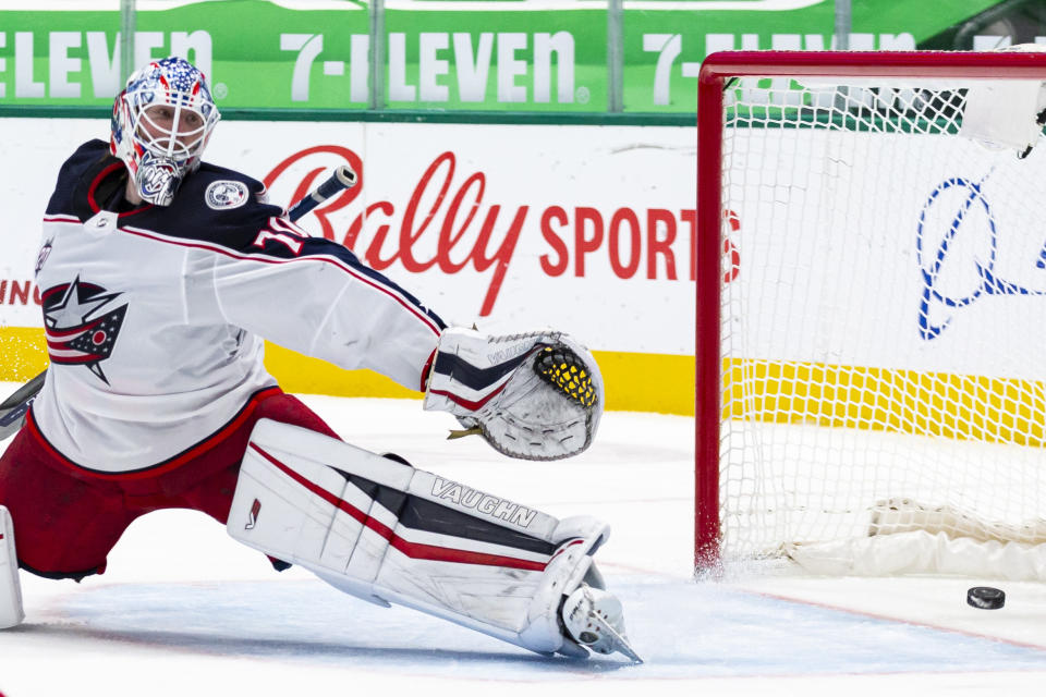 Columbus Blue Jackets goaltender Joonas Korpisalo (70) is unable to stop Dallas Stars right wing Denis Gurianov's shot during the second period of an NHL hockey game Saturday, April 17, 2021, in Dallas. (AP Photo/Sam Hodde)