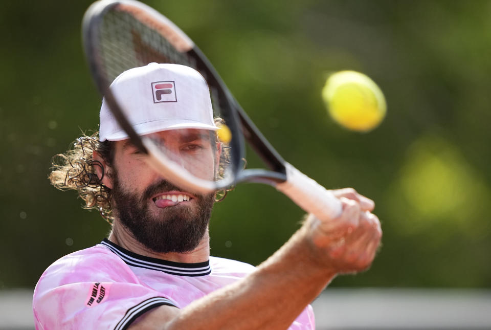 United States's Reilly Opelka plats return to Spains Jaume Lunar during their second round match on day four of the French Open tennis tournament at Roland Garros in Paris, France, Wednesday, June 2, 2021. (AP Photo/Michel Euler)
