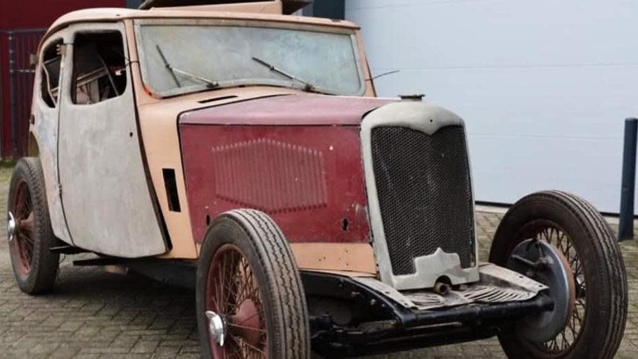 Vintage car shell with grey and red chassis