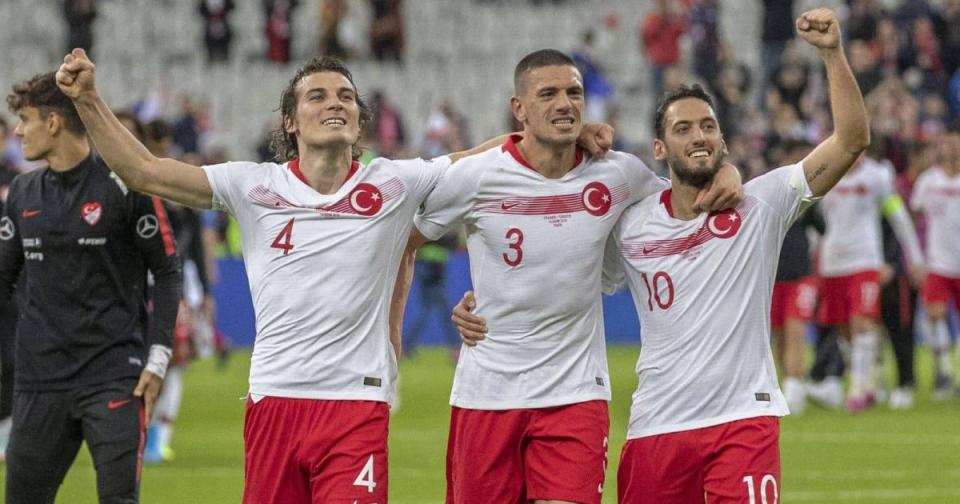 Caglar Soyuncu, Merih Demiral, Hakan Calhanoglu of Turkey celebrating with supporters at the end of the qualifying match at Euro 2020 group H, match between France and Turkey Credit: Alamy