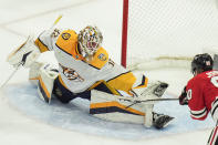 Nashville Predators goaltender Kevin Lankinen stops a shot from Chicago Blackhawks center Tyler Johnson during the second period of an NHL hockey game Friday, April 12, 2024, in Chicago. (AP Photo/Erin Hooley)