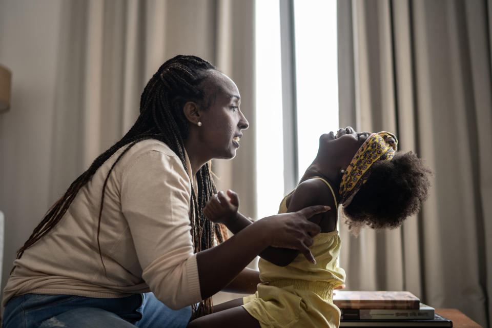 A mom looking at her daughter upset