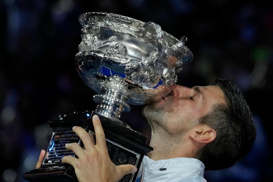 Novak Djokovic kisses the Norman Brookes Challenge Cup (Aaron Favila/AP) (AP)