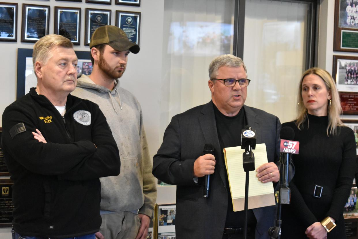 St. Joseph County commissioner Derek Dieter, far left, joins an employee of Tom's Care Center, second from left, and county councilors Joe Thomas and Amy Drake during a press conference held in opposition to a low-barrier homeless shelter on Tuesday, Jan. 30, 2024.