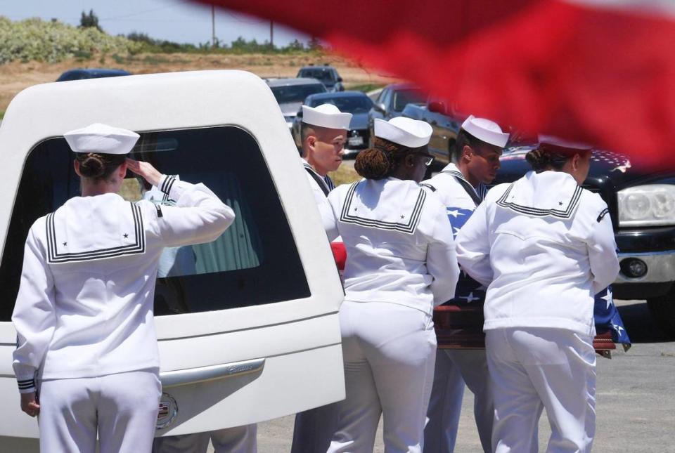 The casket containing the remains of Seaman 2nd Class Denver True “D.T.” Kyser, is removed from the hearse at Fresno Memorial Gardens Saturday afternoon, May 21, 2022 in Fresno. Kyseer’s remains were finally identified through modern DNA technology. Kyser, 18 at the time, was assigned to and serving on the battleship USS Oklahoma when it was attacked by Japanese aircraft as it was moored at Ford Island, Pearl Harbor on Dec. 7, 1941.